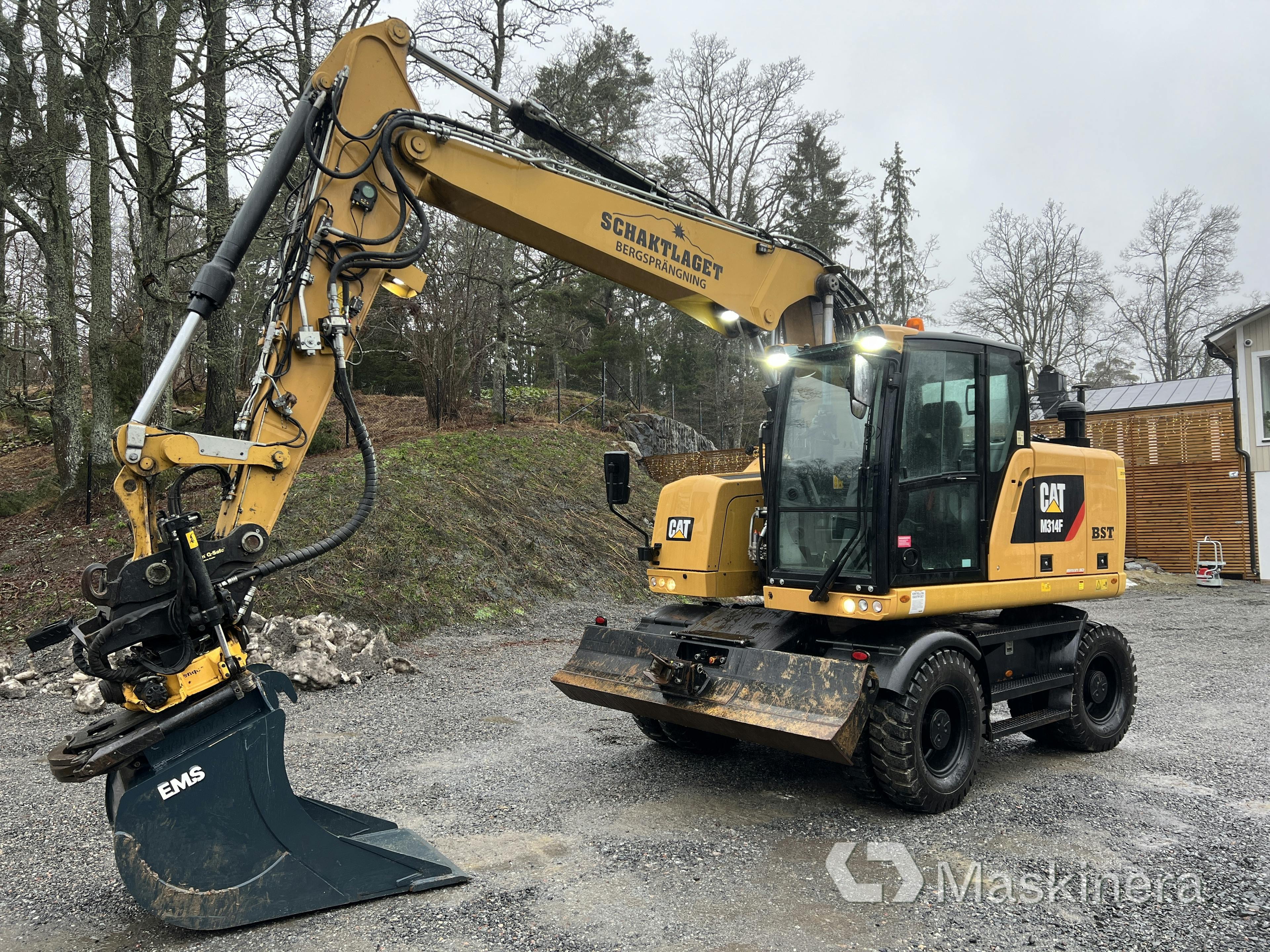 Wheeled excavator CAT M314F with trolley, buckets & digging system